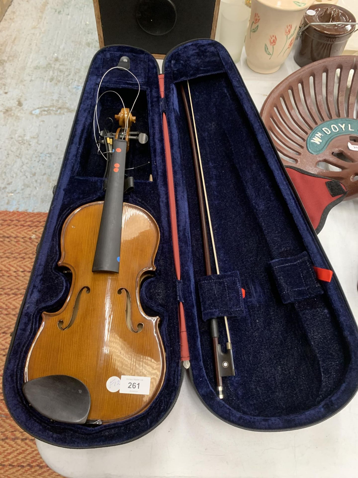 A CASED VIOLIN AND BOW