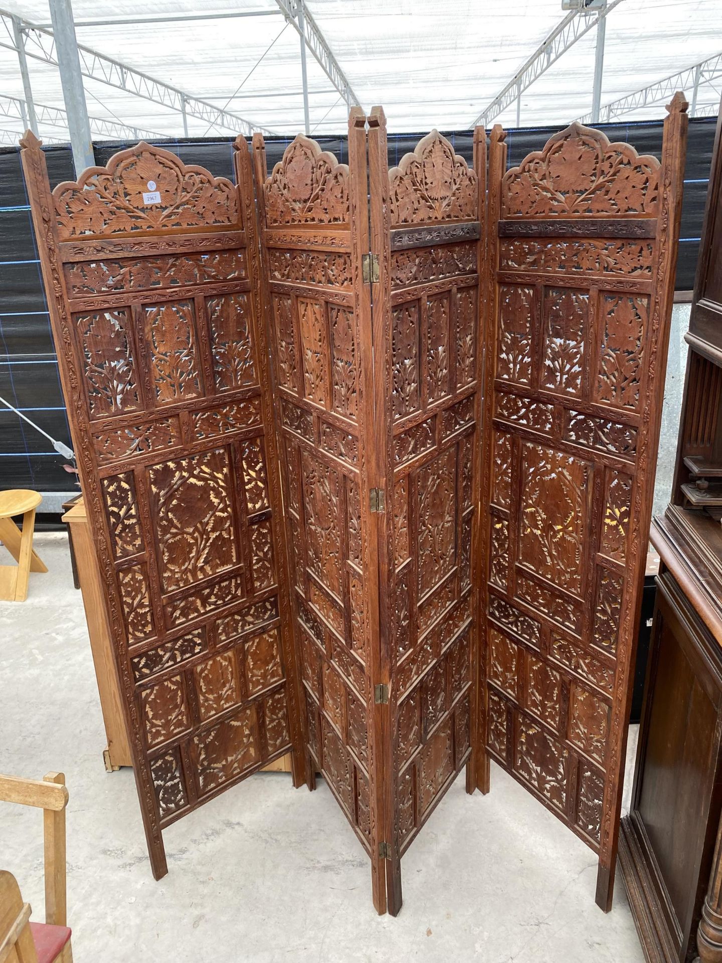 A PROFUSELY CARVED HARDWOOD MOROCCAN DIVISION SCREEN, EACH PANEL, 71" HIGH AND 19.5" WIDE