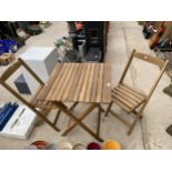 A TEAK FOLDING BISTRO TABLE AND TWO CHAIRS