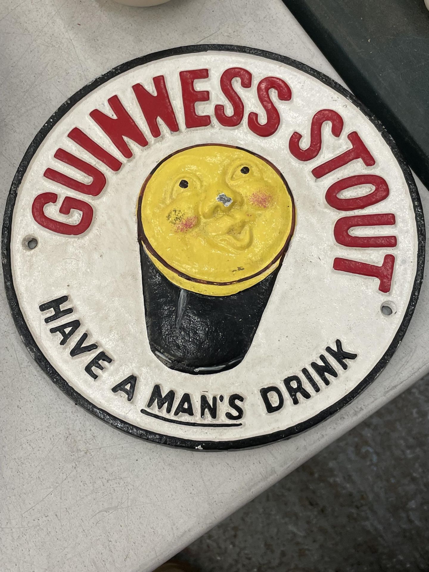 A CAST METAL GUINNESS STOUT SIGN