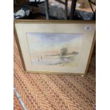 A FRAMED WATERCOLOUR OF A LAKE SCENE WITH INDISTINCT SIGNATURE 54CM X 43CM