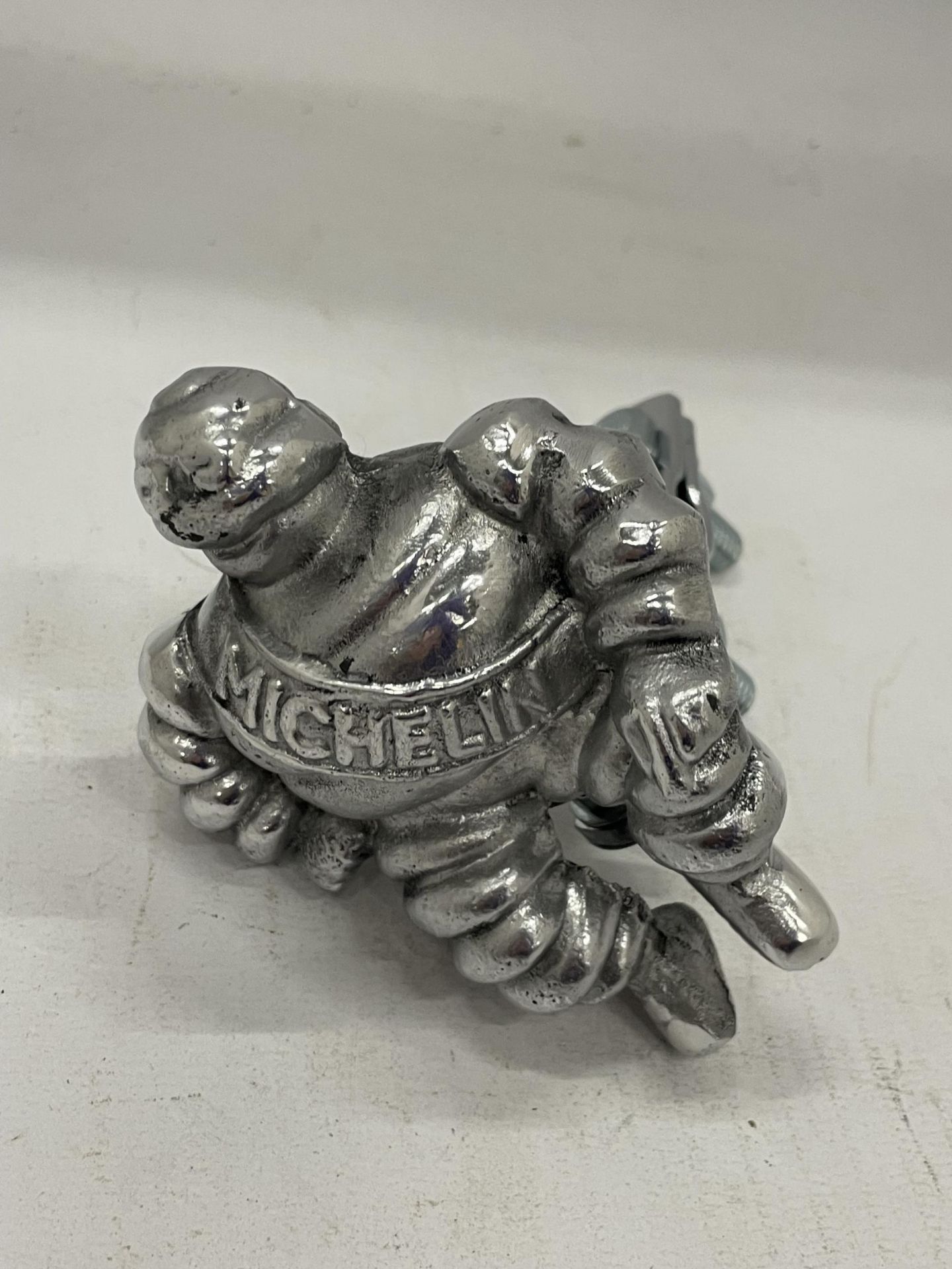 A MICHELIN MAN WITH RACK / BADGE BAR CLAMP