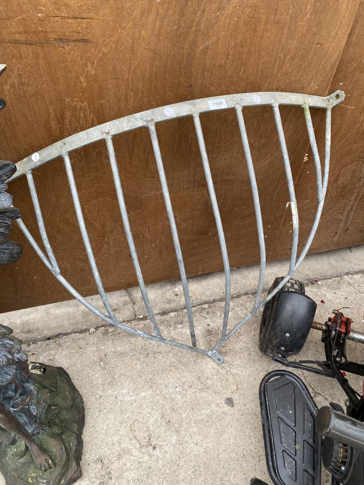 A LARGE HEAVY GALVANISED CORNER HAYRACK