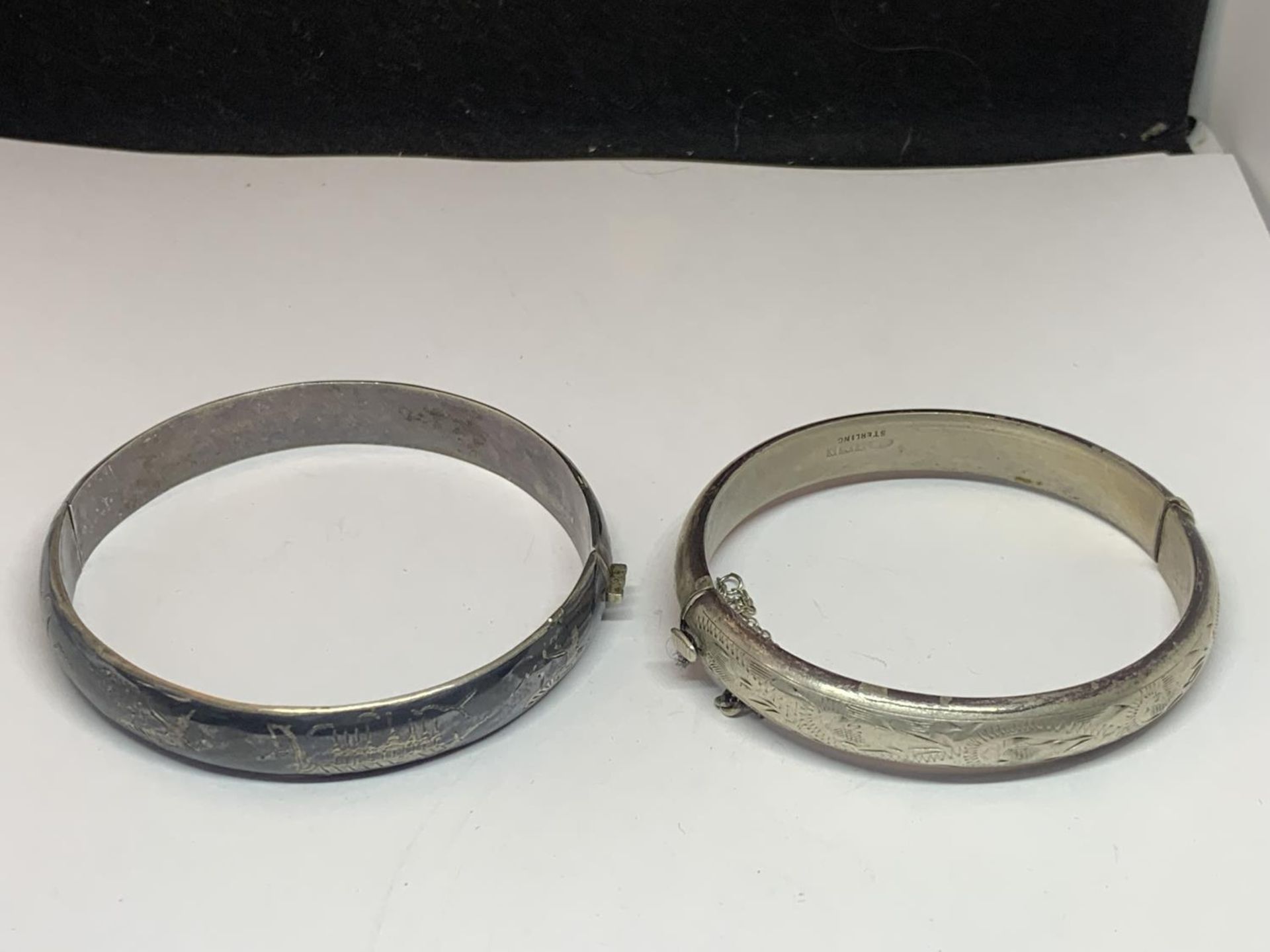 TWO SILVER BANGLES TO INCLUDE A SIAM EXAMPLE