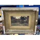 AN ANTIQUE GILT FRAMED OIL PAINTING OF A VILLAGE SCENE, UNSIGNED