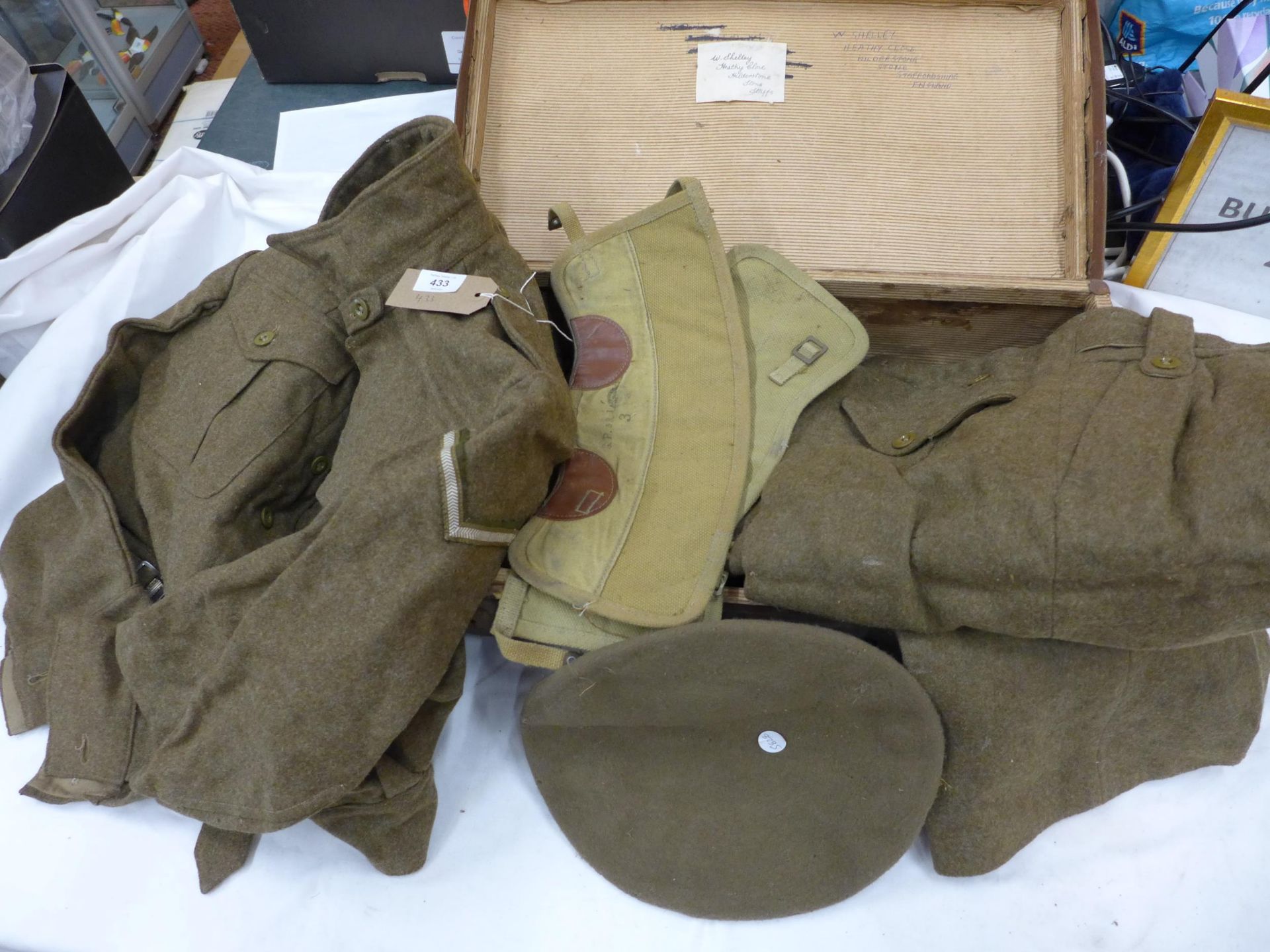 A BRITISH ARMY CORPORALS BATTLEDRESS, DATED 1946 AND A SUITCASE