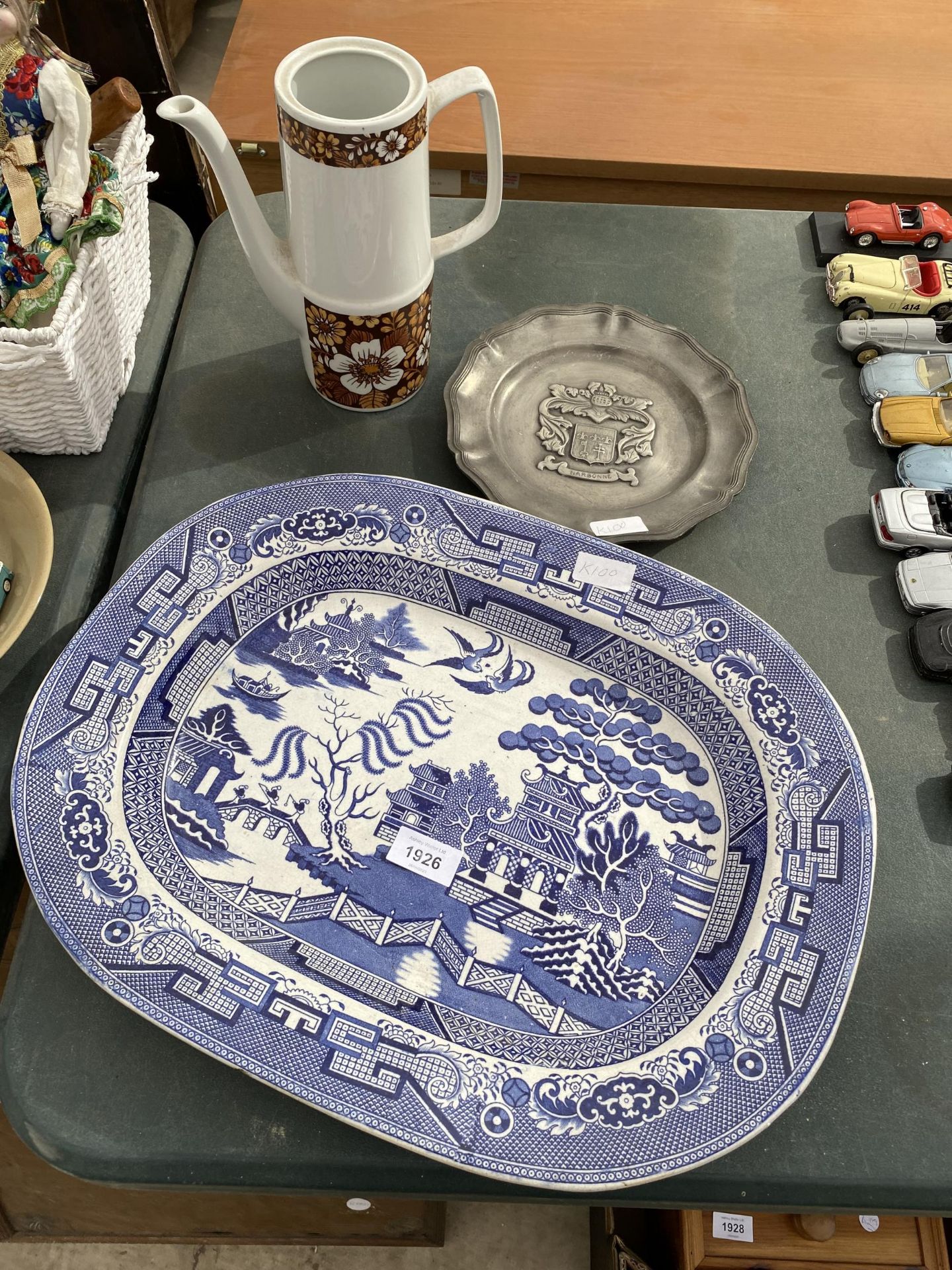 A LARGE BLUE AND WHITE MEAT PLATE, A HEAVY METAL PLAQUE AND A COFFEE POT