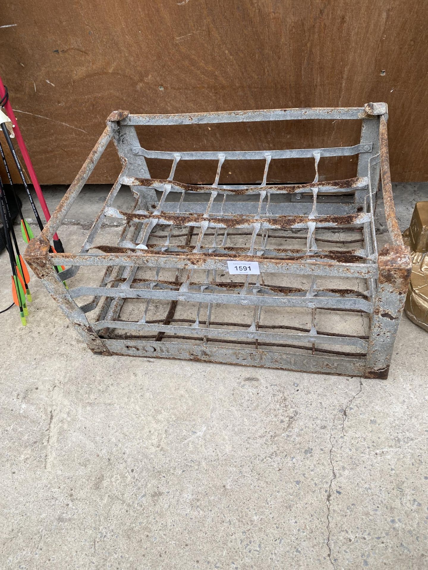 A TWENTY SECTION GALVANISED MILK BOTTLE CRATE