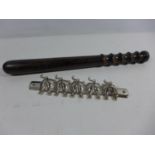 A POLICE TRUNCHEON, LENGTH 39CM, PIG METAL COAT RACK, LENGTH 22CM (2)