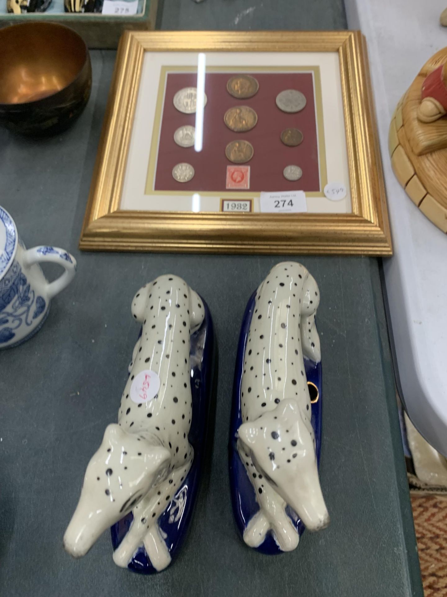 A PAIR OF STAFFORDSHIRE DALMATIONS AND A FRAIMED 1982 COIN SET