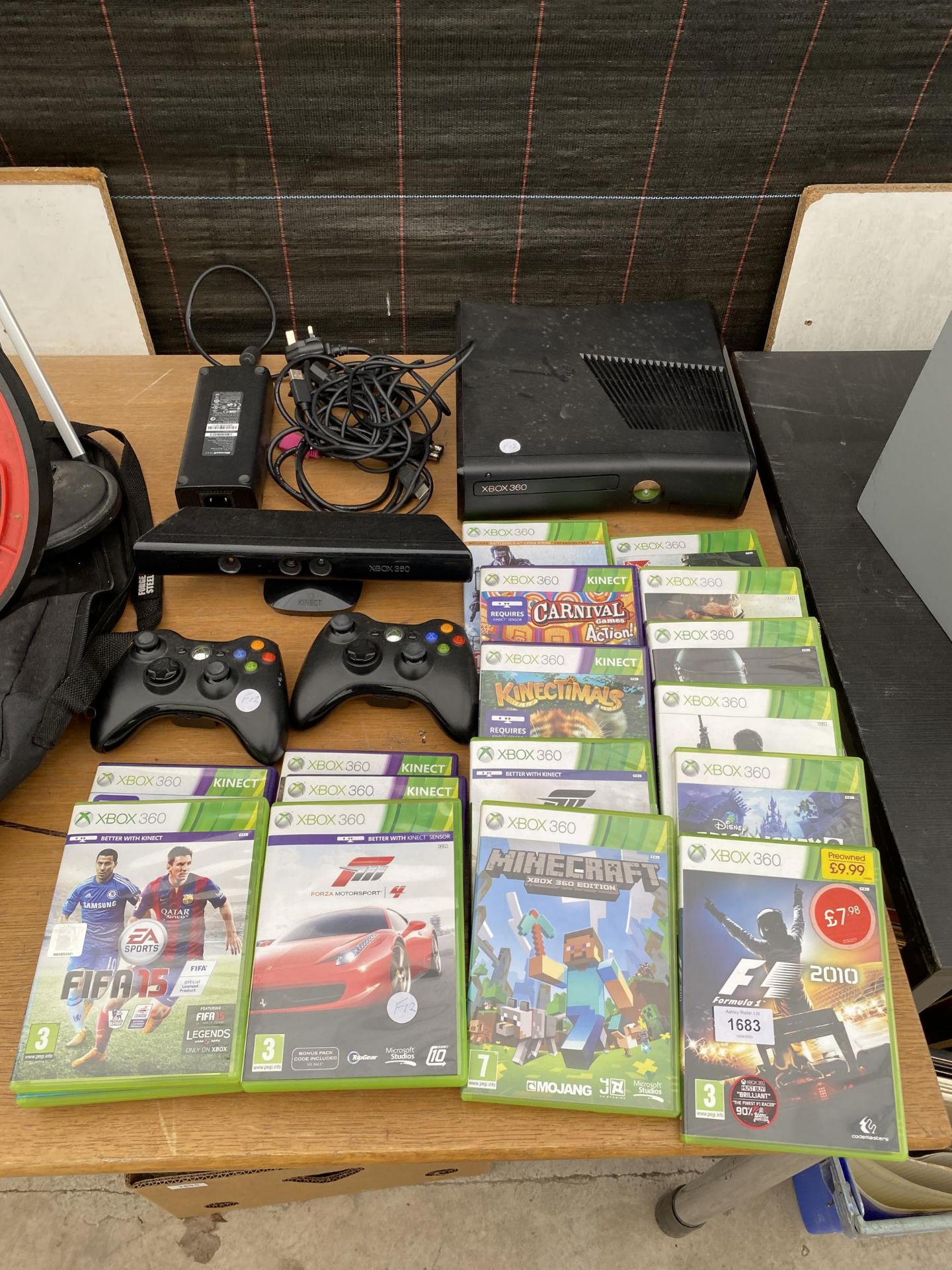 AN XBOX 360 WITH XBOX KINECT, TWO CONTROLLERS AND VARIOUS GAMES