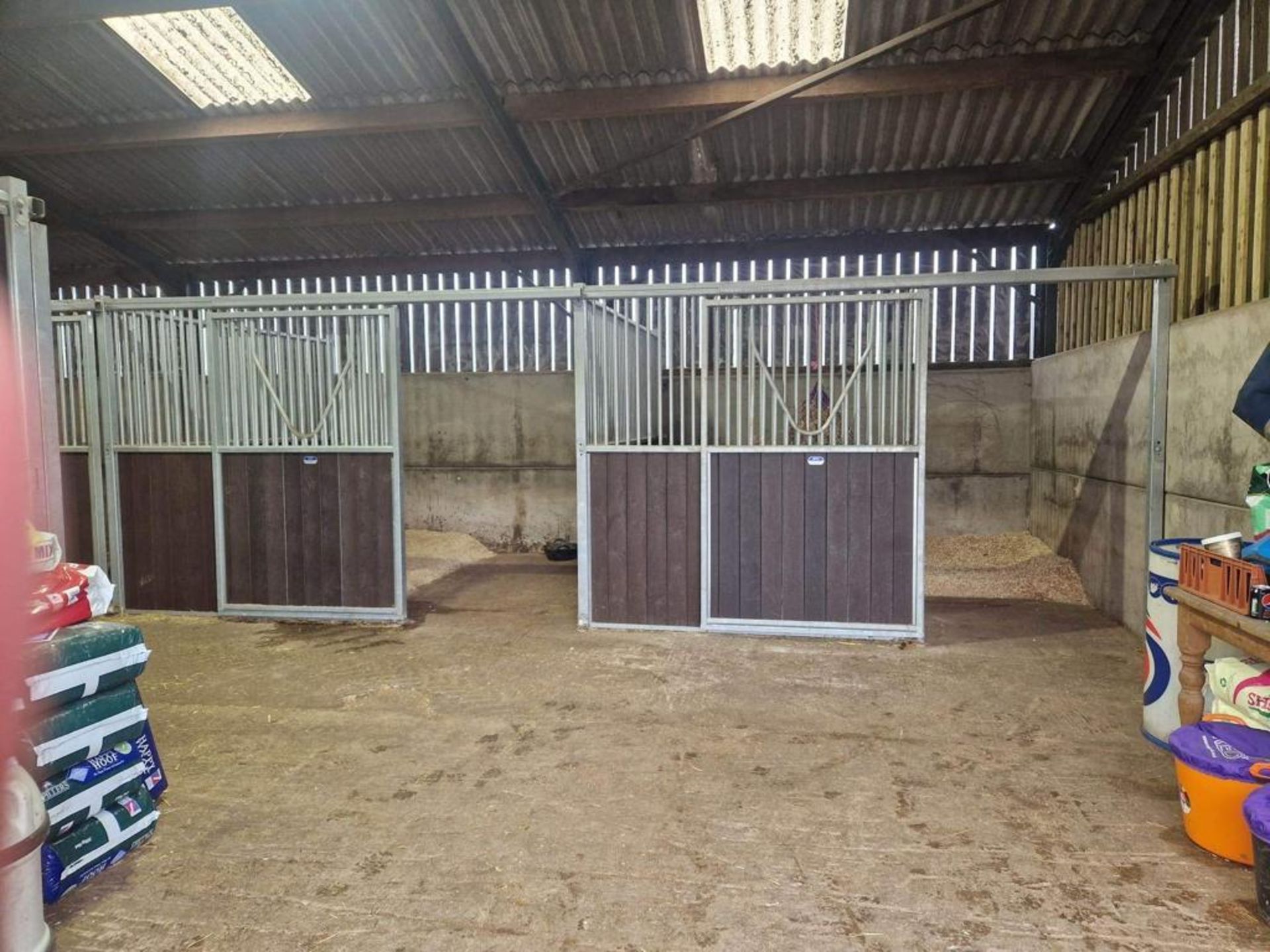 TEN AEI STABLES OF 9 MIDDLES 12' X 10' NO END WITH SLIDING DOORS AND ANTI WEAVE BARS ALL SPRUNG