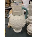 A CREAMWARE STYLE JUG WITH EMBOSSED SERPENTS AND GREEN HANDLE, HEIGHT 34CM - A/F