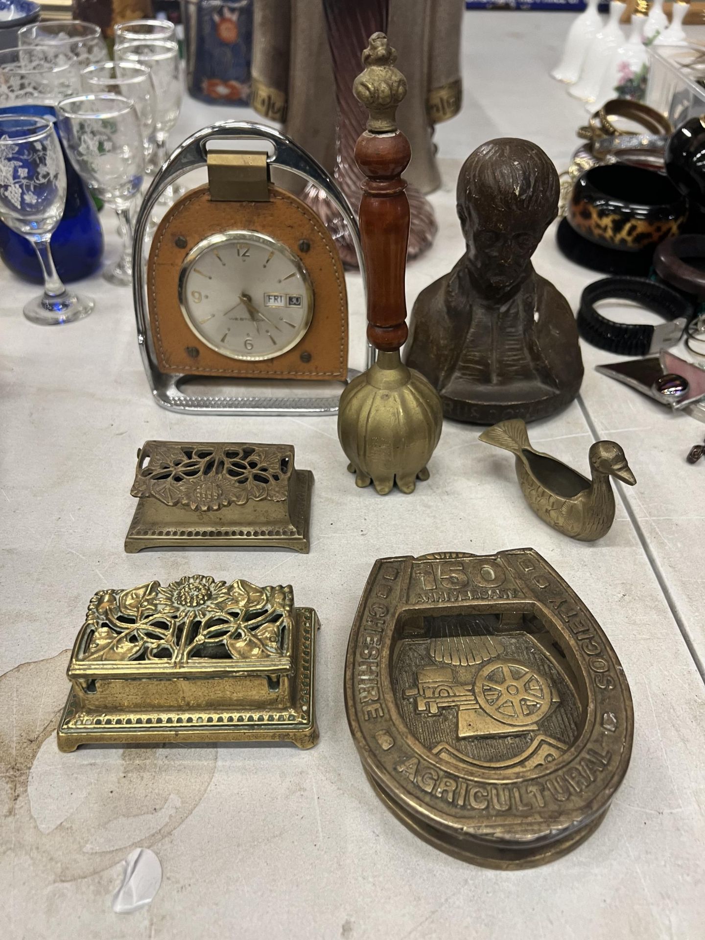 A VINTAGE CLOCK IN A STIRRUP, TWO BRASS STAMP BOXES, A CHESHIRE AGRICULTURAL SOCIETY HORSESHOE