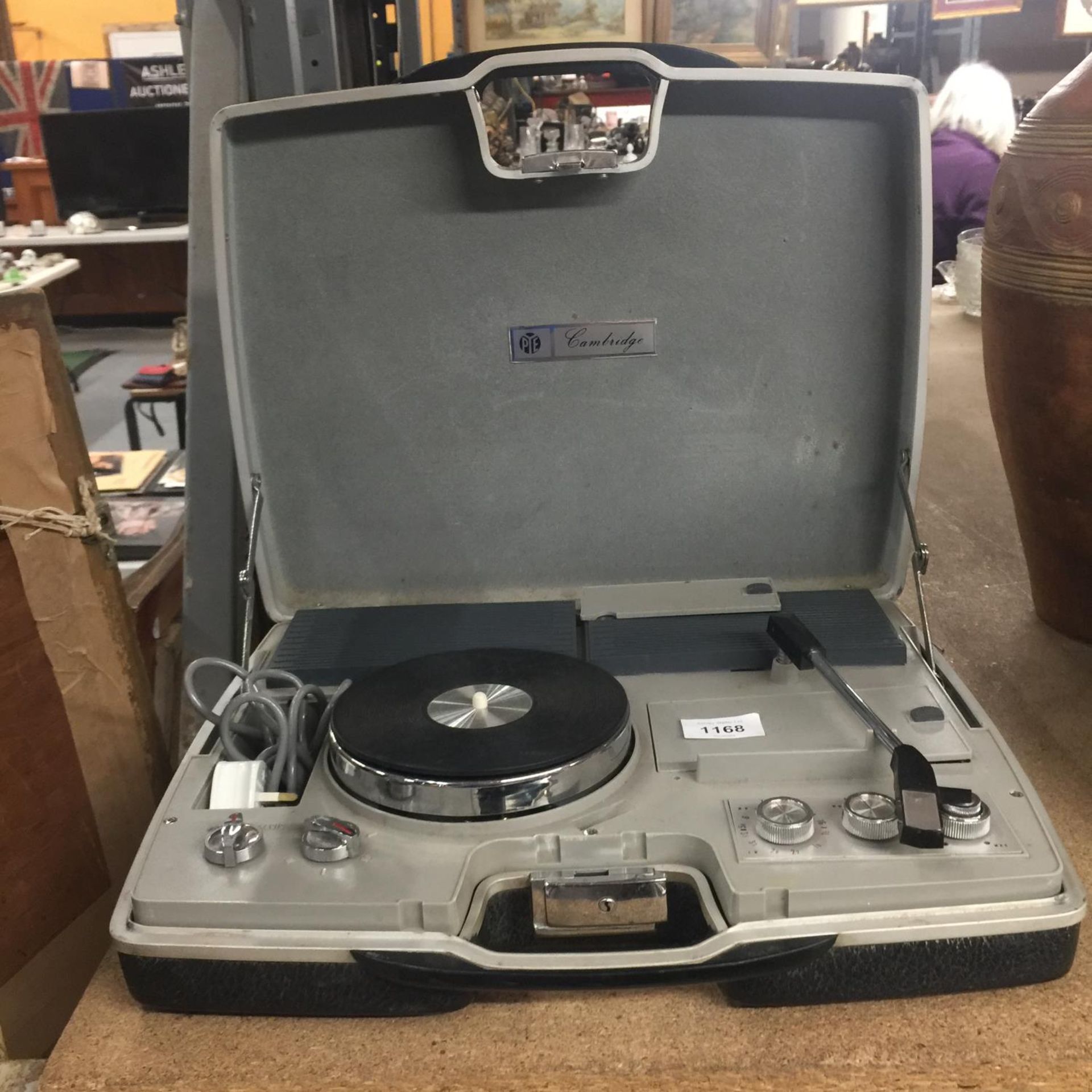 A VINTAGE PYE PORTABLE RECORD PLAYER IN A CASE