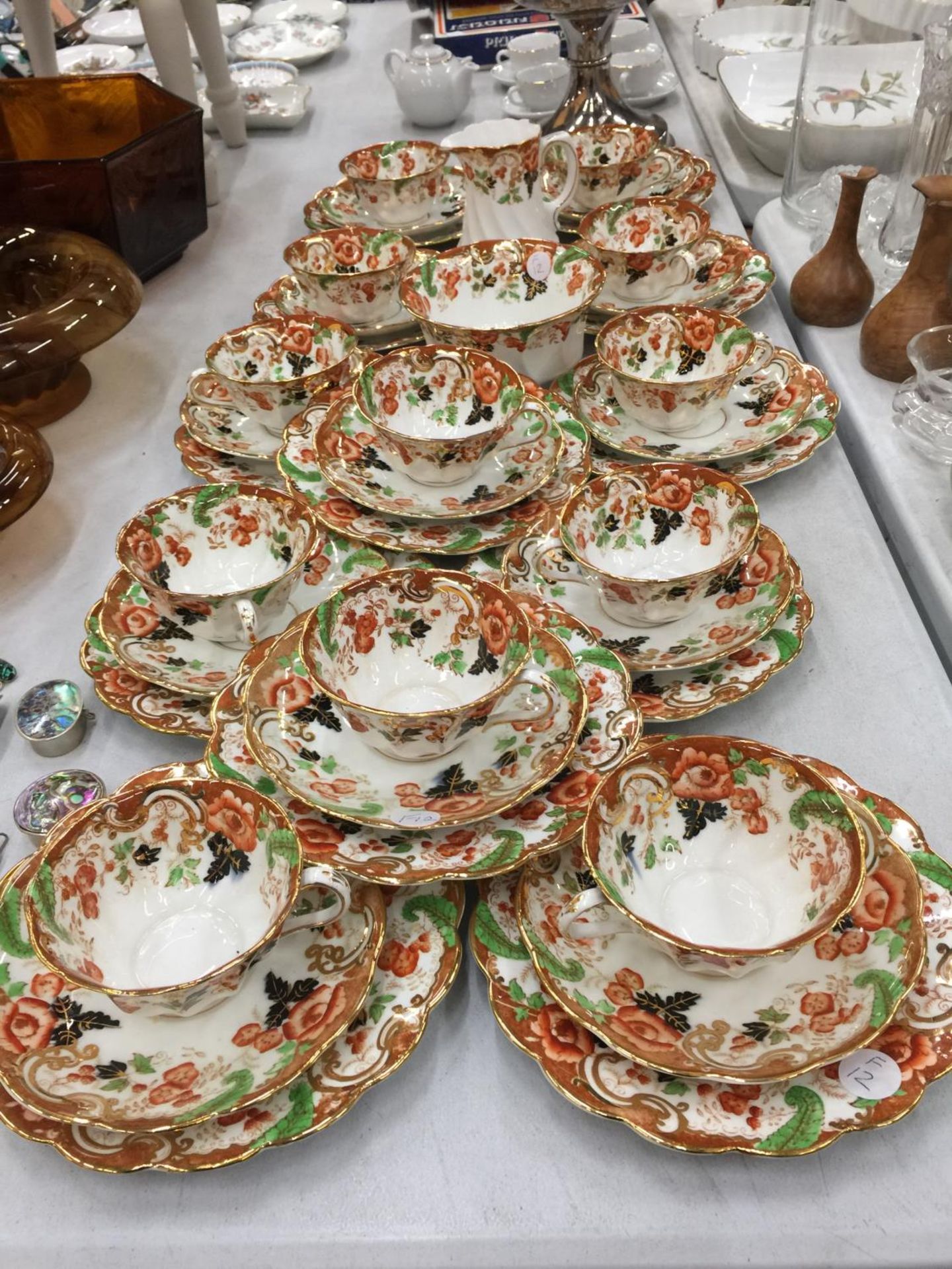 A LARGE QUANTITY OF ROYAL WINDSOR CHINA CUPS, SAUCERS AND SIDE PLATES PLUS A CREAM JUG AND SUGAR