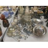 A LARGE QUANTITY OF SILVER PLATED ITEMS TO INCLUDE FLATWARE, CRUETS, A TEAPOT, SERVING DISHES, A