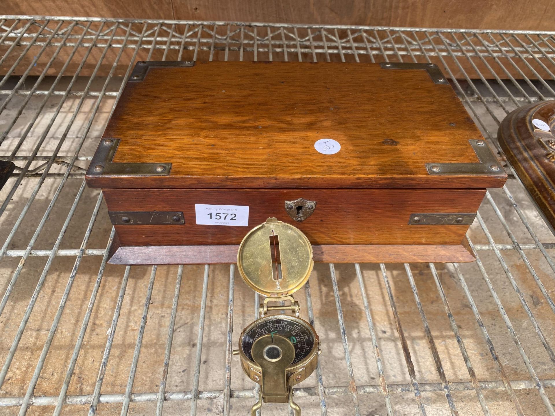 A VINTAGE WOODEN BOX AND A BRASS COMPASS