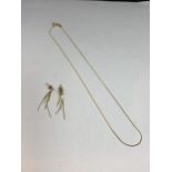 A 9 CARAT GOLD NECLACE AND A PAIR OF EARRINGS GROSS WEIGHT 2.9 GRAMS