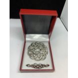 TWO MARKED SILVER CELTIC STYLE BROOCHES IN A PRESENTATION BOX