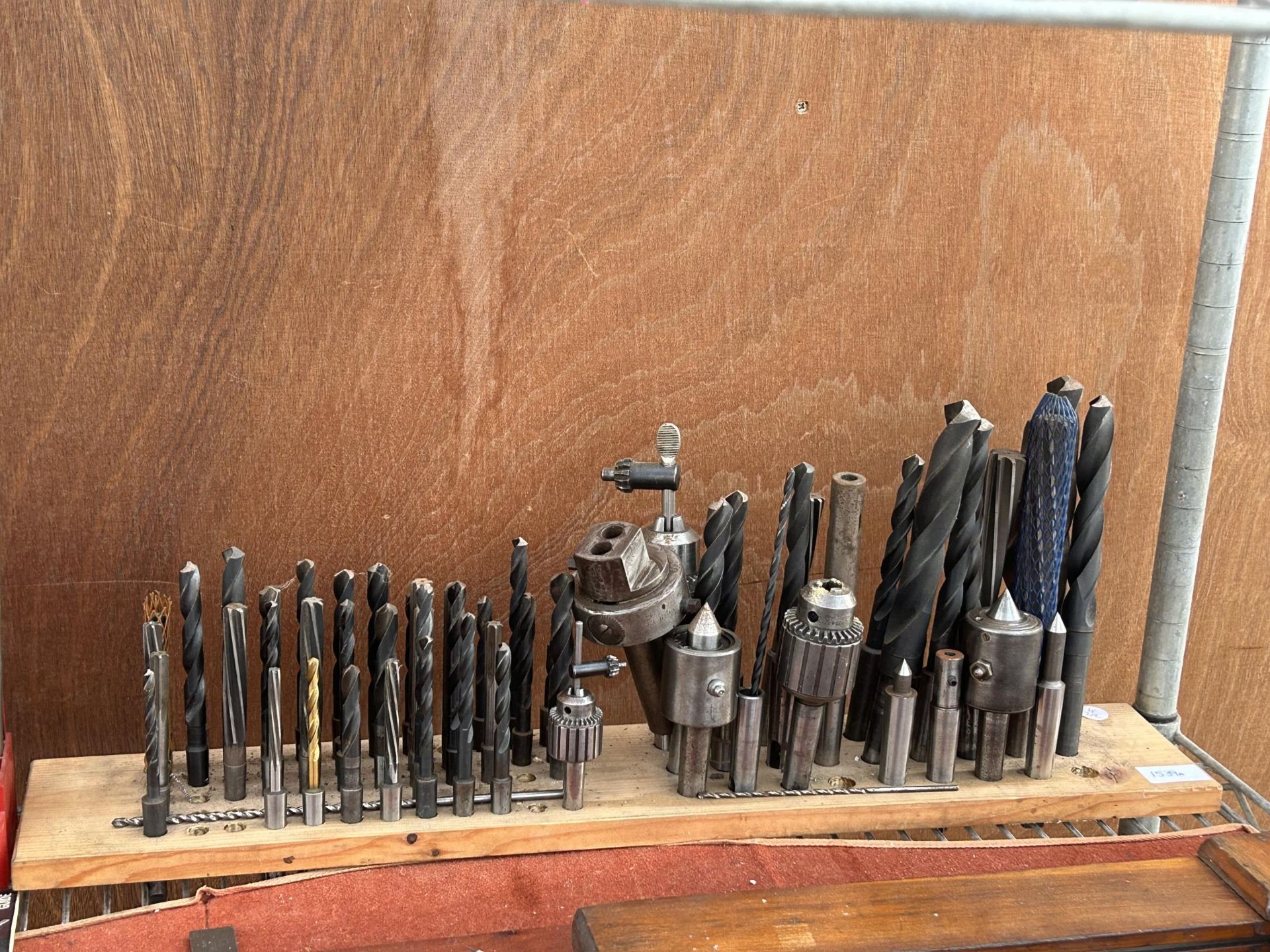 A LARGE ASSORTMENT OF DRILL BITS AND DRILL CHUCKS