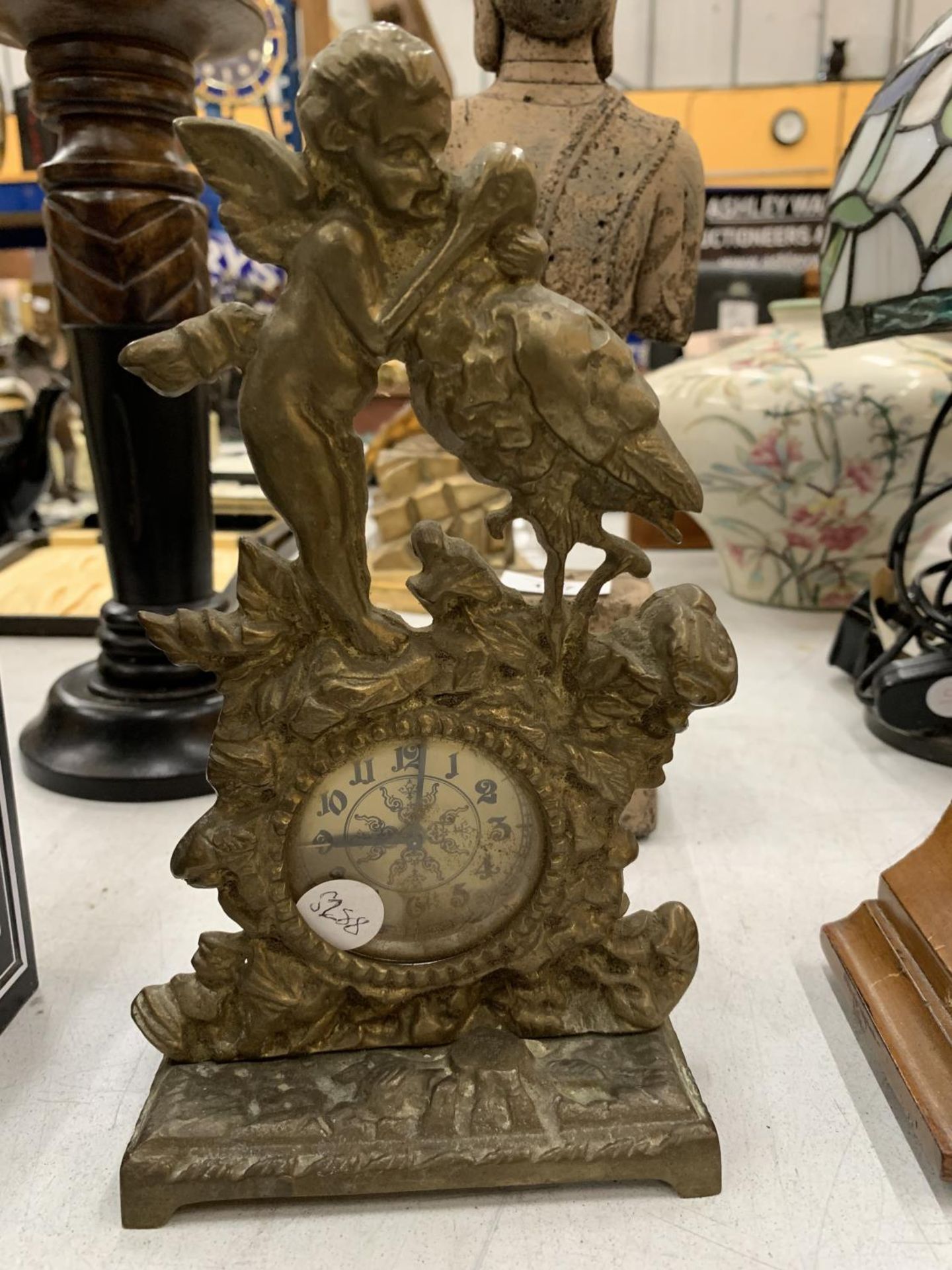 A VINTAGE BRASS ALARM CLOCK WITH ORNATE CHERUB AND STORK DETAIL PLUS A WHITE METAL TRINKET BOX - Image 2 of 6