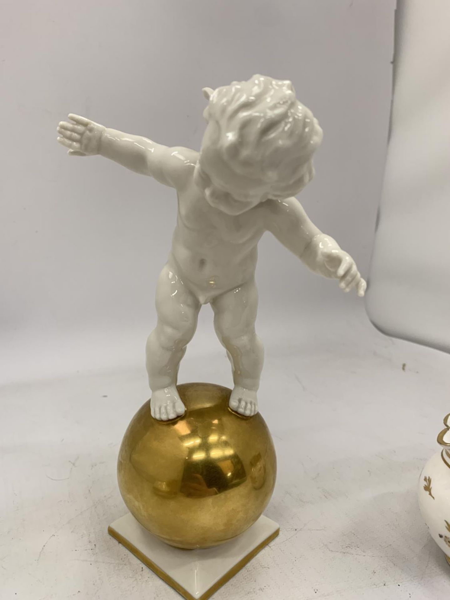 A GERMAN FIGURE OF A CHERUB ON A GILT ORB, SIGNED TO THE BASE AND IMPRESSED WITH THE NAME K. TUTTER, - Image 4 of 6