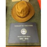 A WESLEY CRICKET BOOK AND HAT