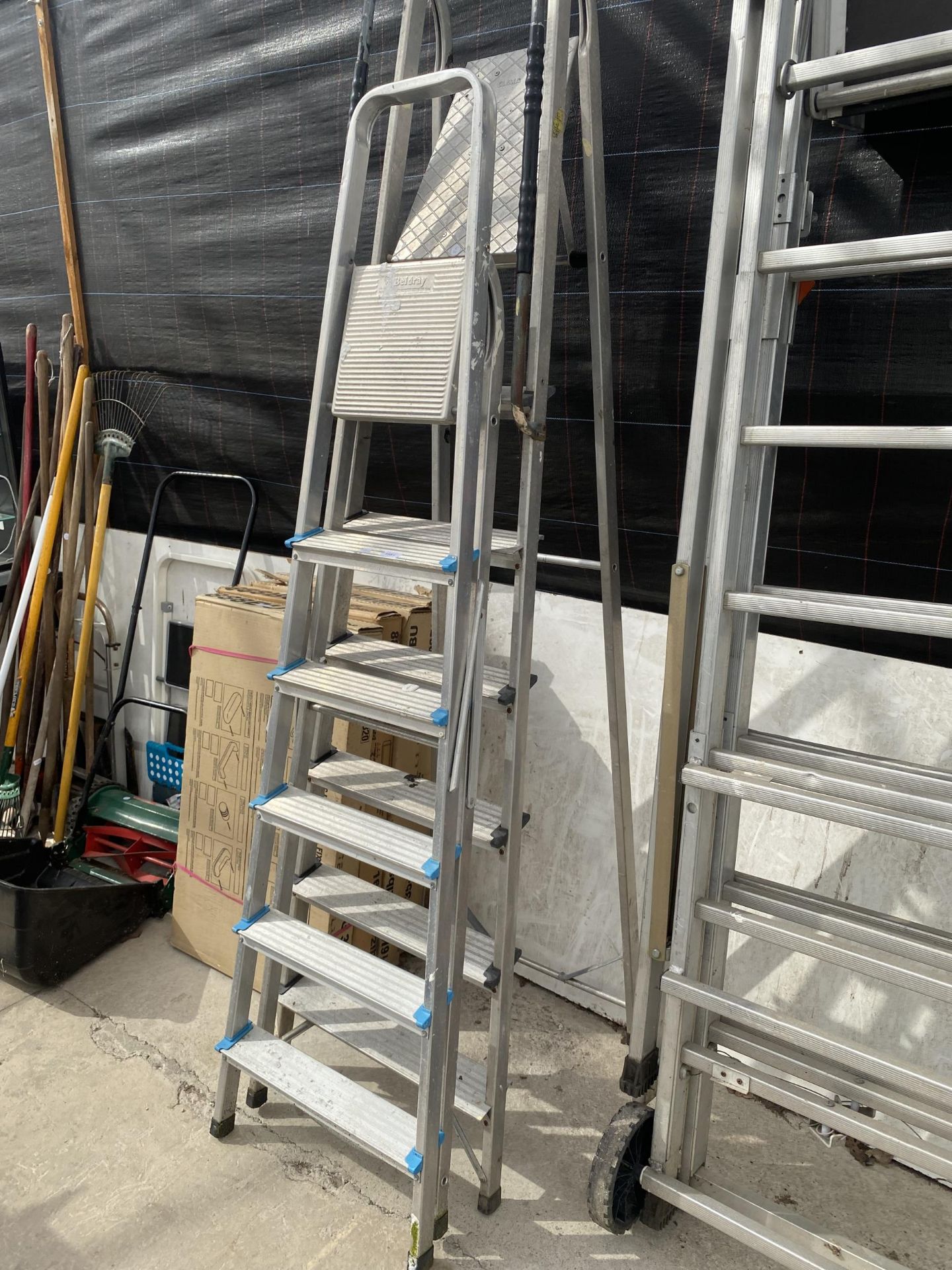 A FIVE RUNG ALUMINIUM AND A FURTHER SIX RUNG ALUMINIUM STEP LADDER