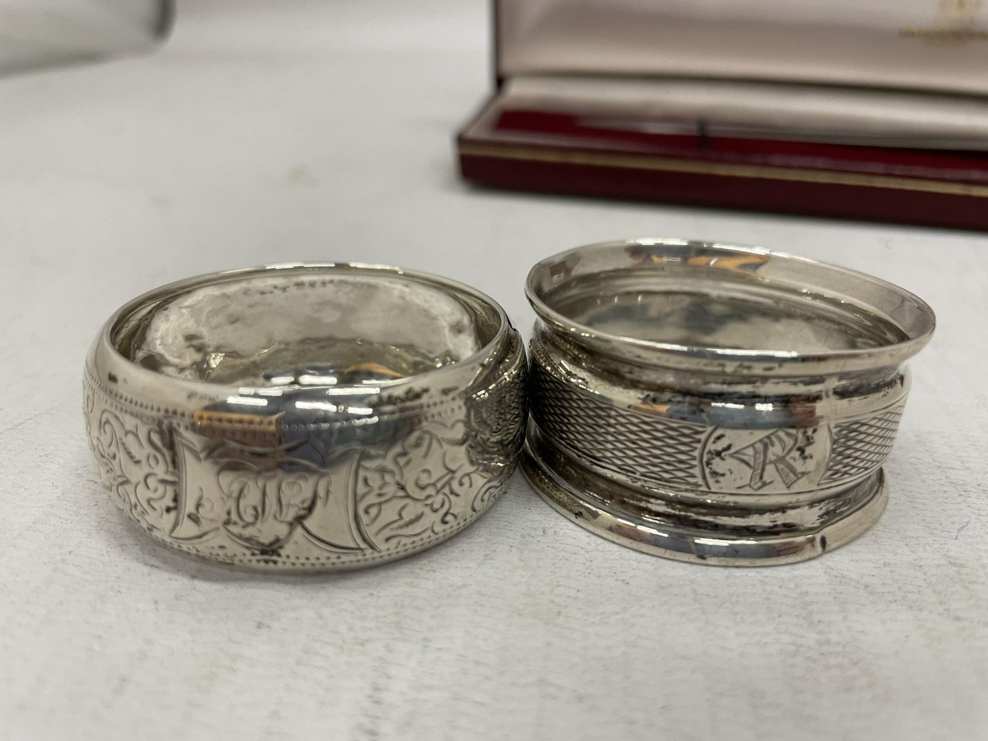 A CASED HALLMARKED SILVER HANDLED LETTER OPENER AND TWO HALLMARKED SILVER NAPKIN RINGS, TOTAL WEIGHT - Image 3 of 7