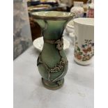 AN ORIENTAL JADE TYPE VASE WITH WHITE METAL OVERLAY