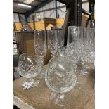 A COLLECTION OF CUT GLASS DRINKING GLASSES, BRANDY GOBLETS, CLARET JUG ETC