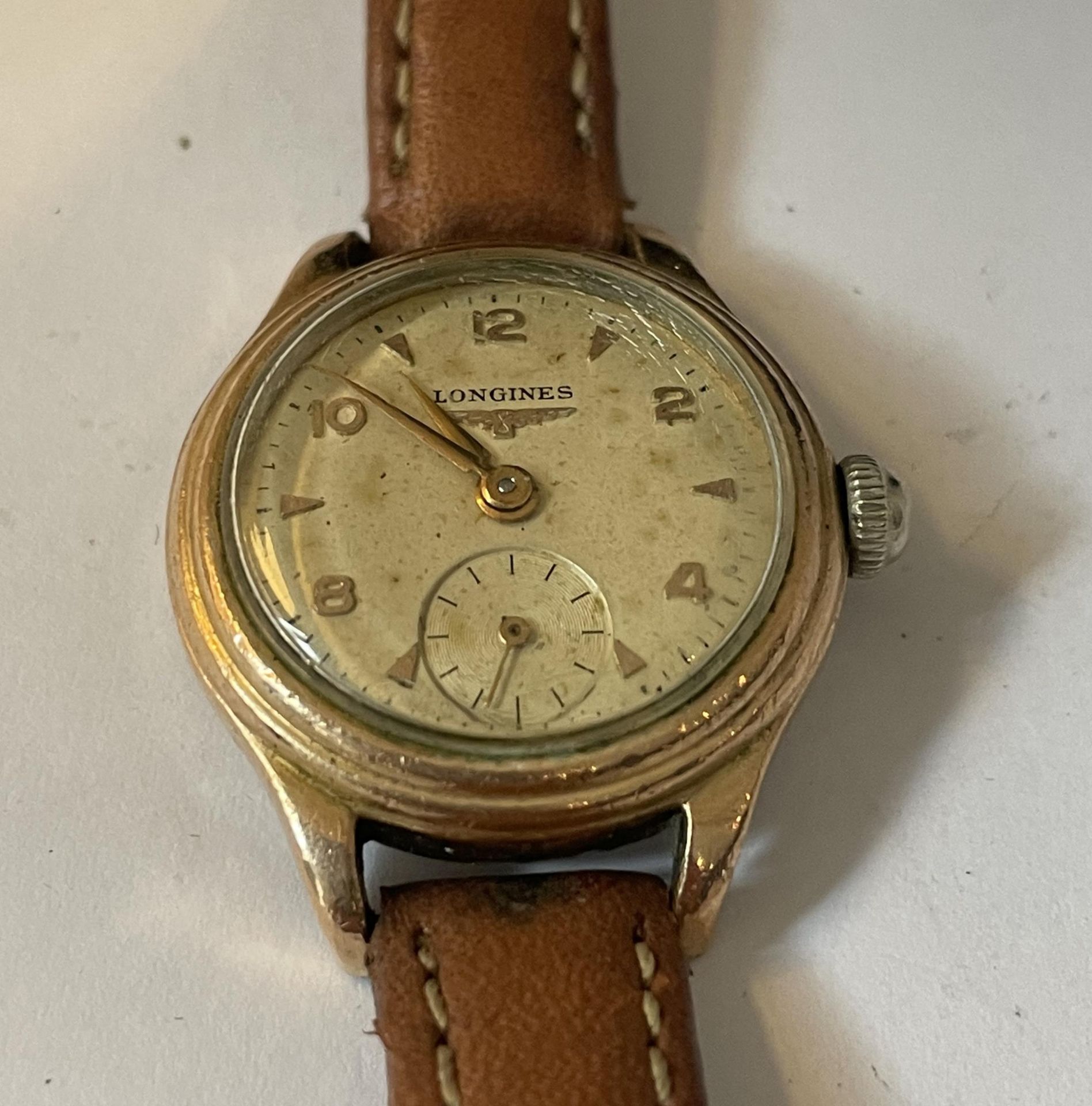 A LADIES VINTAGE LONGINES WRIST WATCH WITH TAN LEATHER STRAP