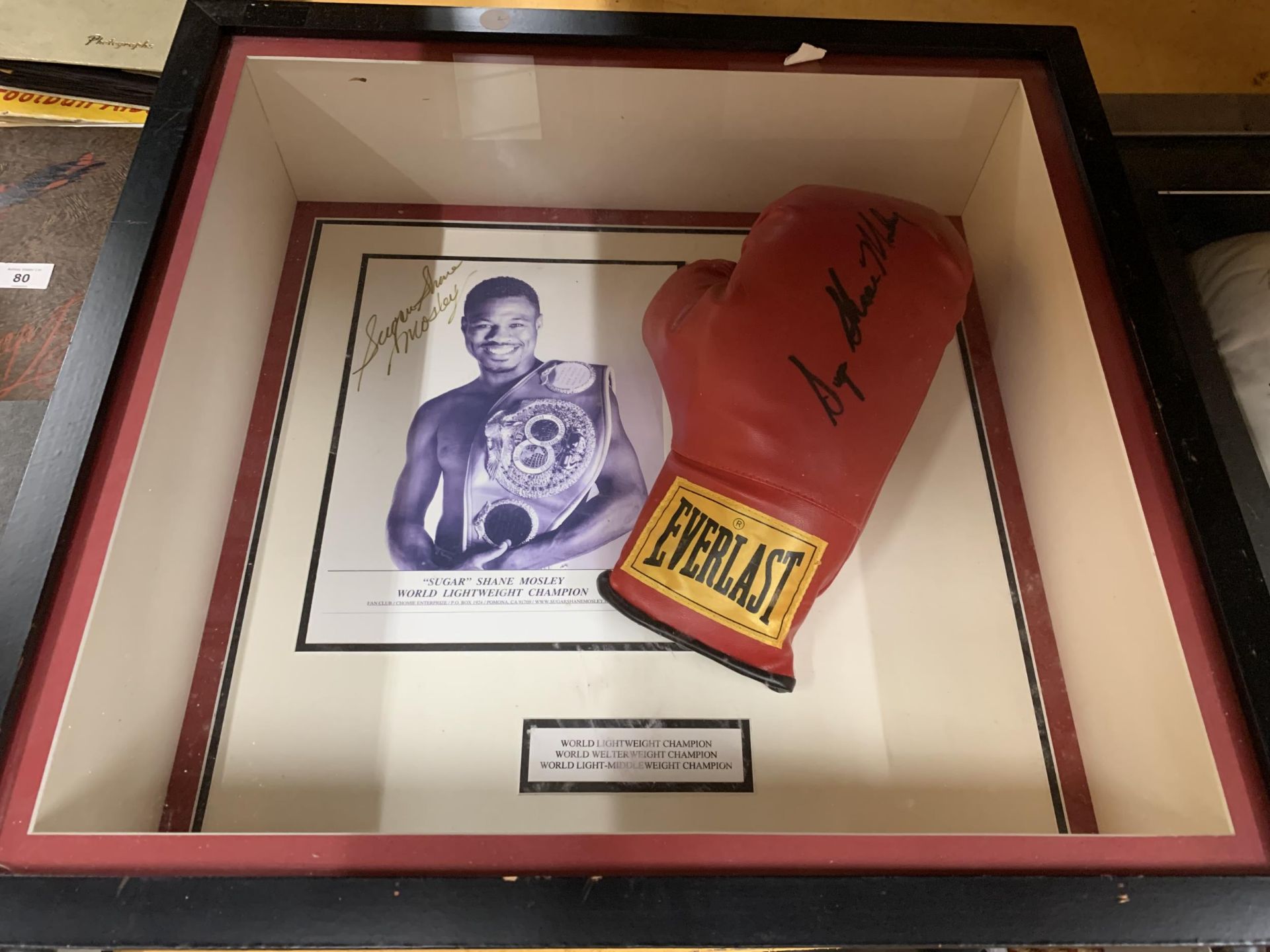 A FRAMED & SIGNED SUGAR SHANE MOSLEY BOXING GLOVE & PHOTOGRAPH