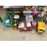 A LARGE ASSORTMENT OF TOYS AND GAMES TO INCLUDE BARBIES, HOT WHEELS AND A SKATEBOARD ETC