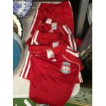 TWO CHILDREN'S LIVERPOOL KITS TO INCLUDE SHORTS AND A SHIRT AGE 9 - 12 MONTHS