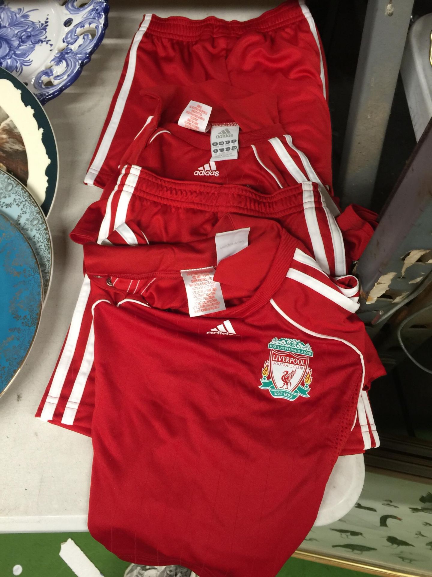 TWO CHILDREN'S LIVERPOOL KITS TO INCLUDE SHORTS AND A SHIRT AGE 9 - 12 MONTHS