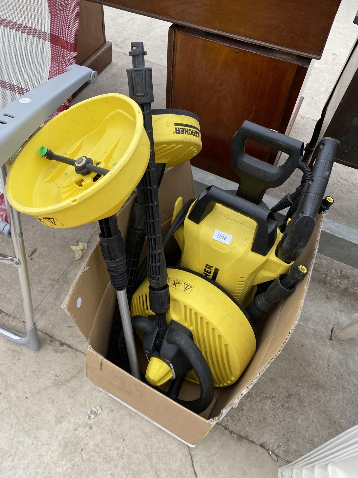 A KARCHER K2 PRESSURE WASHER AND VARIOUS ATTATCHMENTS