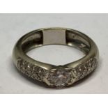 AN 18 CARAT WHITE GOLD RING WITH CENTRE DIAMOND APPROXIMATELY 1 CARAT WITH DIAMOND CHIPS TO THE