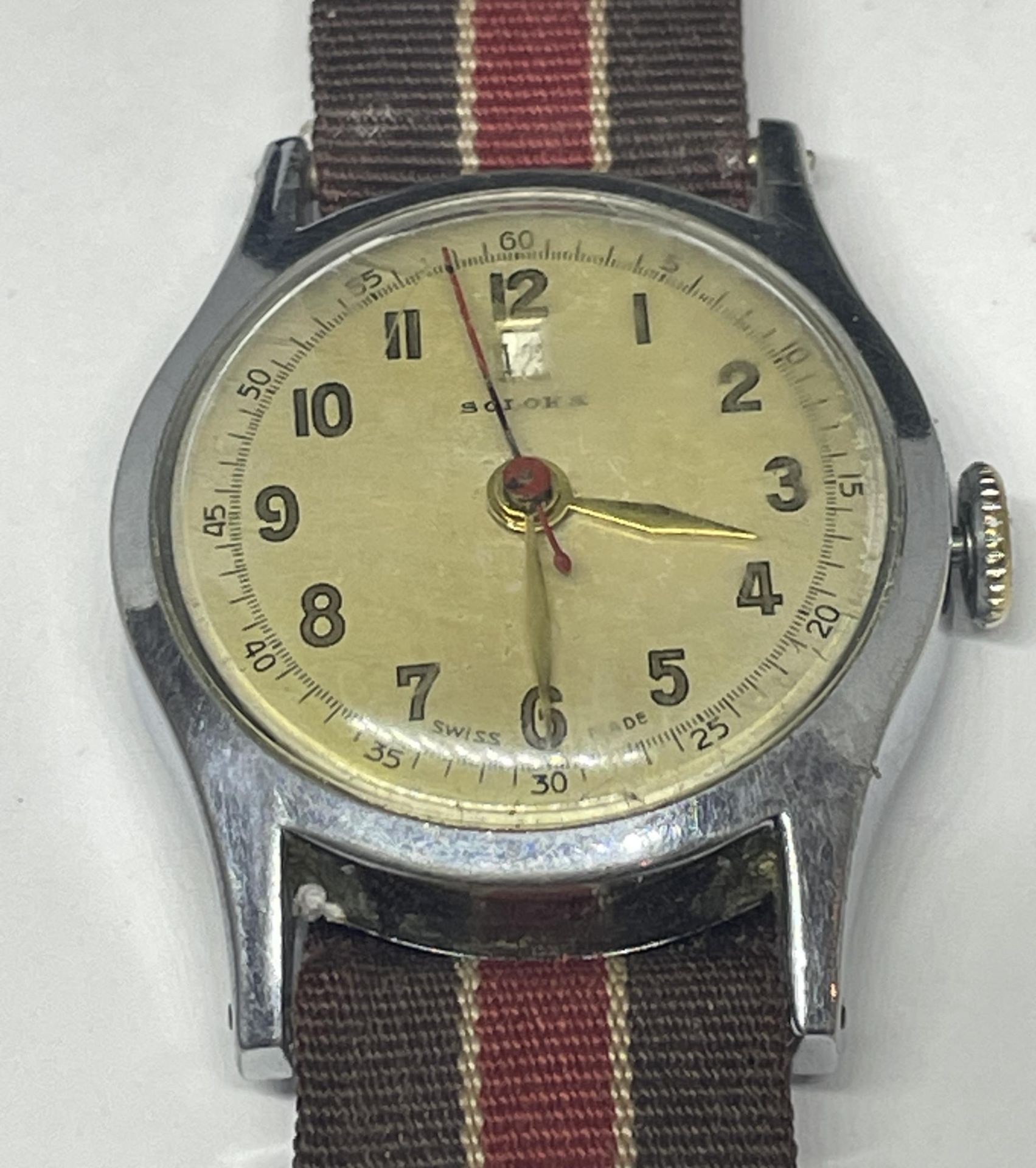 A SOLORA MILITARY STLYE GENTS DATE FUNCTION WRIST WATCH, SEEN WORKING BUT NO WARRANTIES GIVEN
