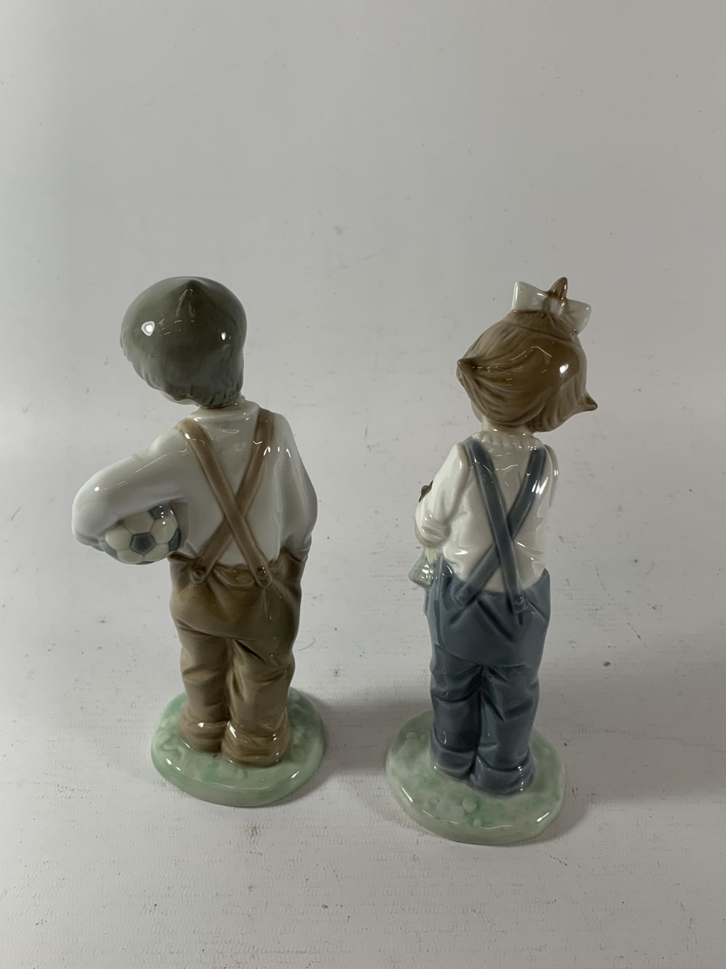 TWO NAO BOY & GIRL FIGURES - ONE WITH A FOOTBALL - Image 2 of 3