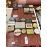 AN ASSORTMENT OF VINTAGE TINS ATTATCHED TO TWO WOODEN BOARDS