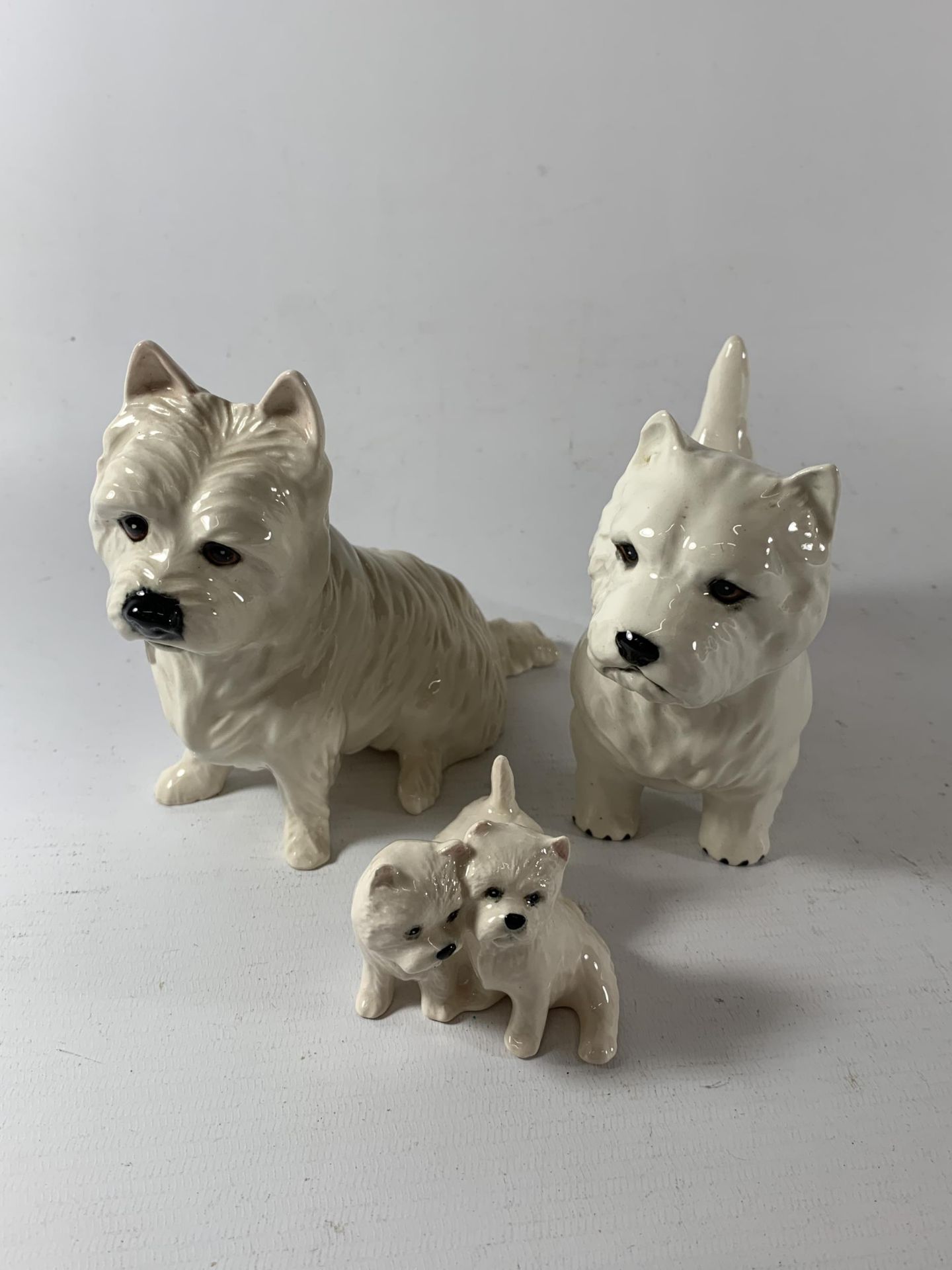 TWO BESWICK SCOTTY DOG FIGURES AND FURTHER ROYAL DOULTON EXAMPLE
