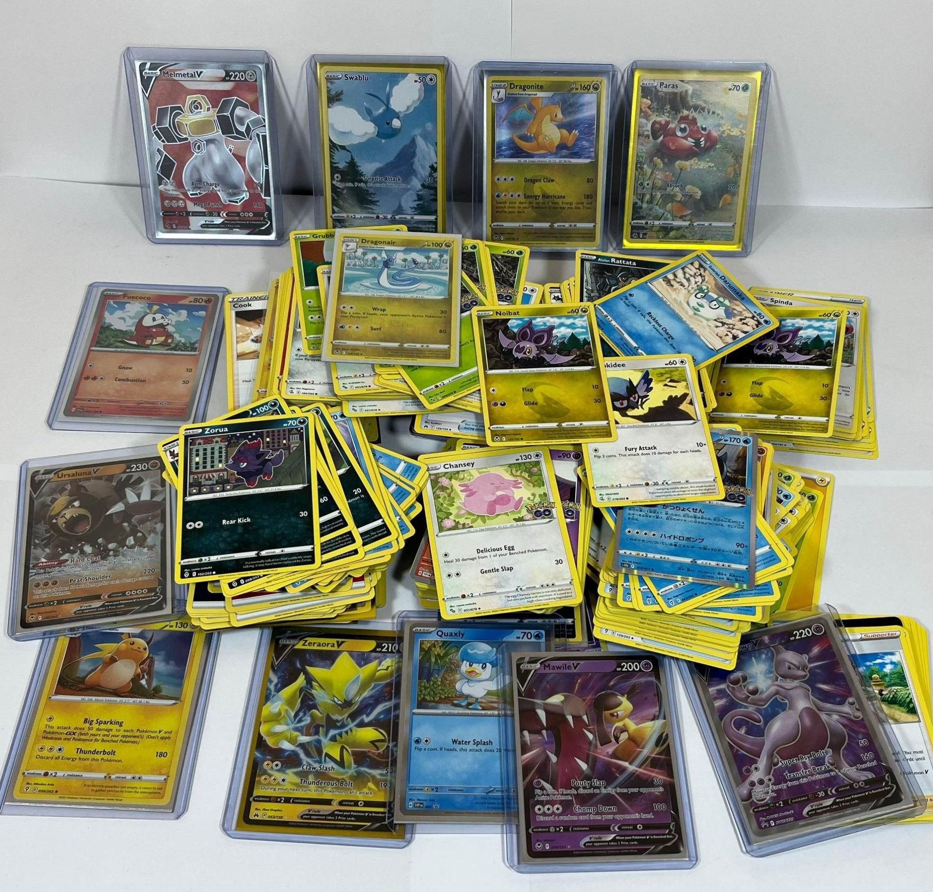 A LARGE COLLECTION OF APPROXIMATELY 400 POKEMON CARDS, V CARDS, HOLOS ETC