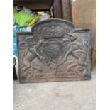 A HEAVY DECORATIVE CAST IRON FIRE BACK