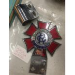 A VINTAGE ENAMEL ORDER OF THE ROAD BUMPER BADGE WITH CLIP