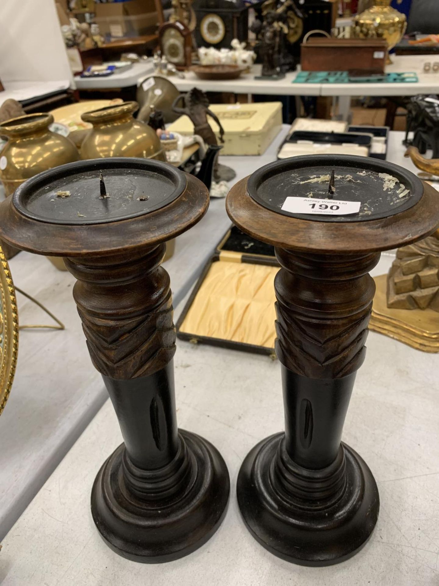 A PAIR OF VINTAGE WOODEN CANDLESTICKS