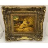 A VICTORIAN GILT FRAMED OIL ON METAL OF TWO HUNTING DOGS, FRAMED BY BIGGS & SONS