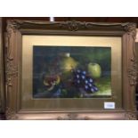 A PAIR OF GILT FRAMED STILL LIFE OIL PAINTINGS OF FRUIT 46CM X 36CM