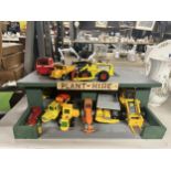 A PLANT HIRE GARAGE WITH TWELVE VARIOUS VEHICLES AND MACHINES